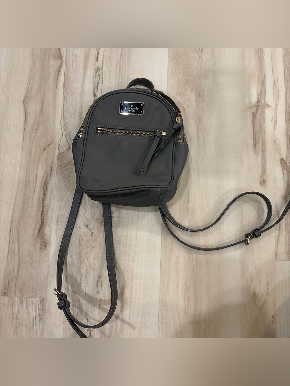 kate spade charcoal gray mini backpack with gold hardware